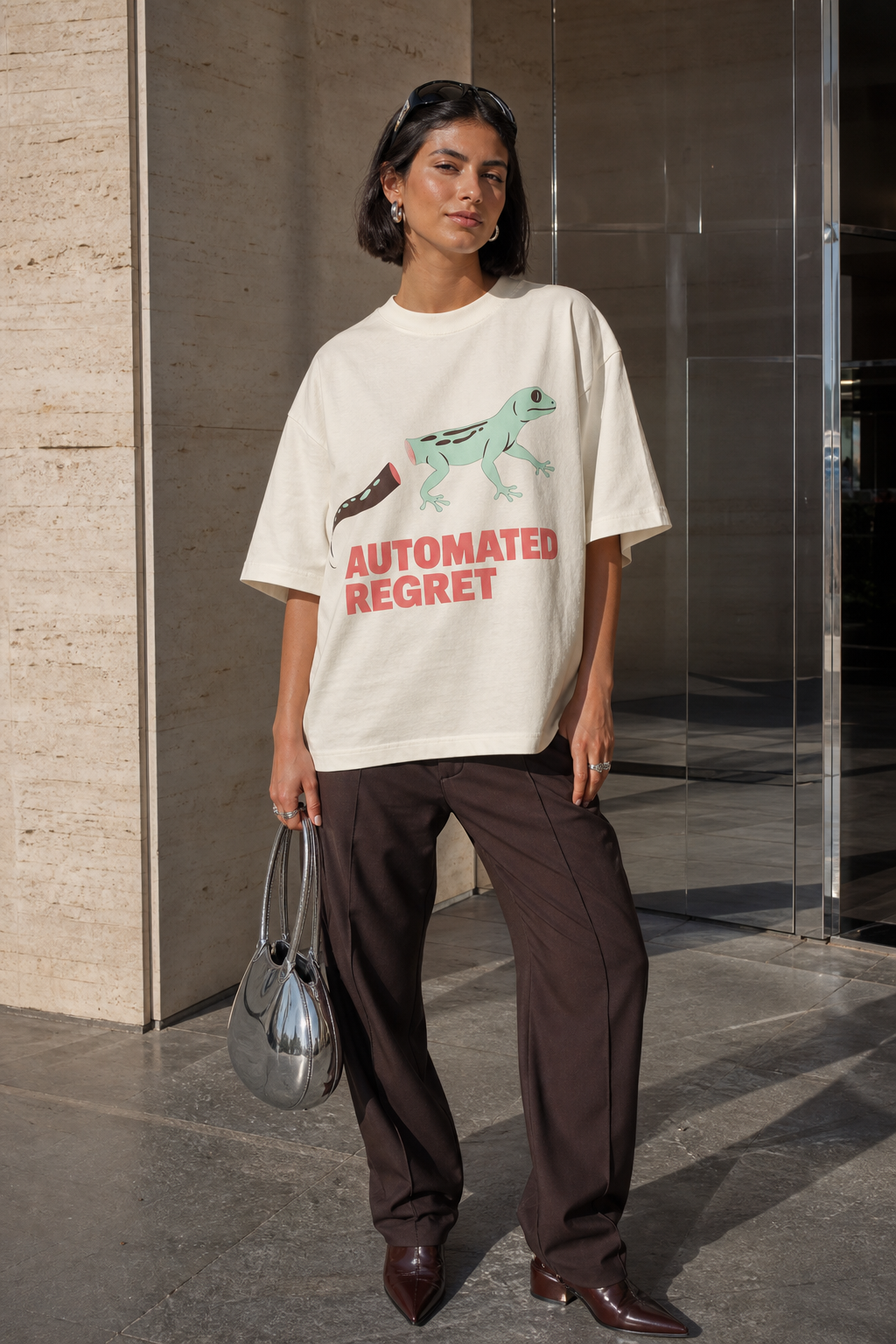 Model wearing the 3o1d AUTOMATED REGRET oversized T-shirt in Cream, front graphic.