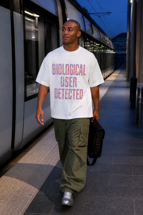 Model wearing the 3o1d BIOLOGICAL USER DETECTED oversized T-shirt in White, front graphic.