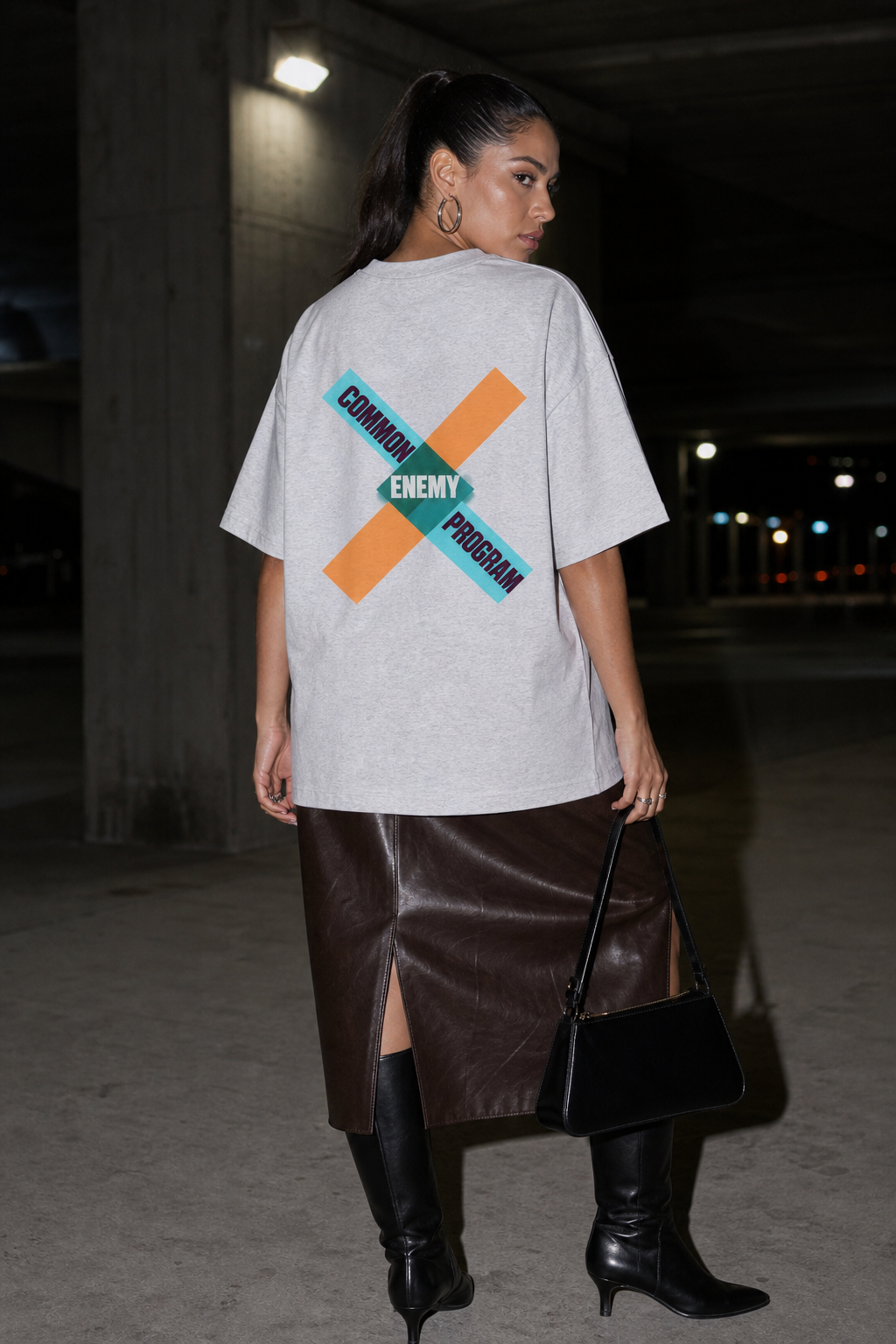 Model wearing the 3o1d COMMON ENEMY PROGRAM oversized T-shirt in Cool Heather Grey, back graphic.