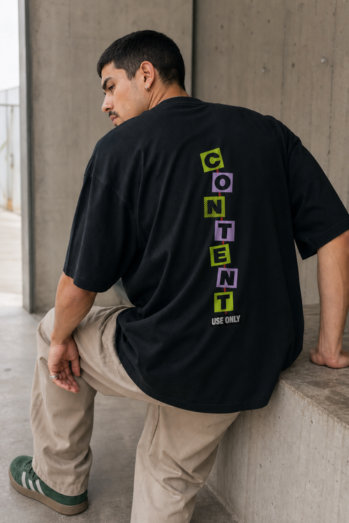 Model wearing the 3o1d CONTENT USE ONLY oversized T-shirt in Black, back graphic.