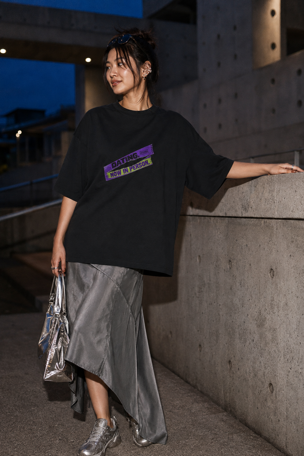 Model wearing the 3o1d DATING, NOW IN PERSON. oversized T-shirt in Black, front graphic.