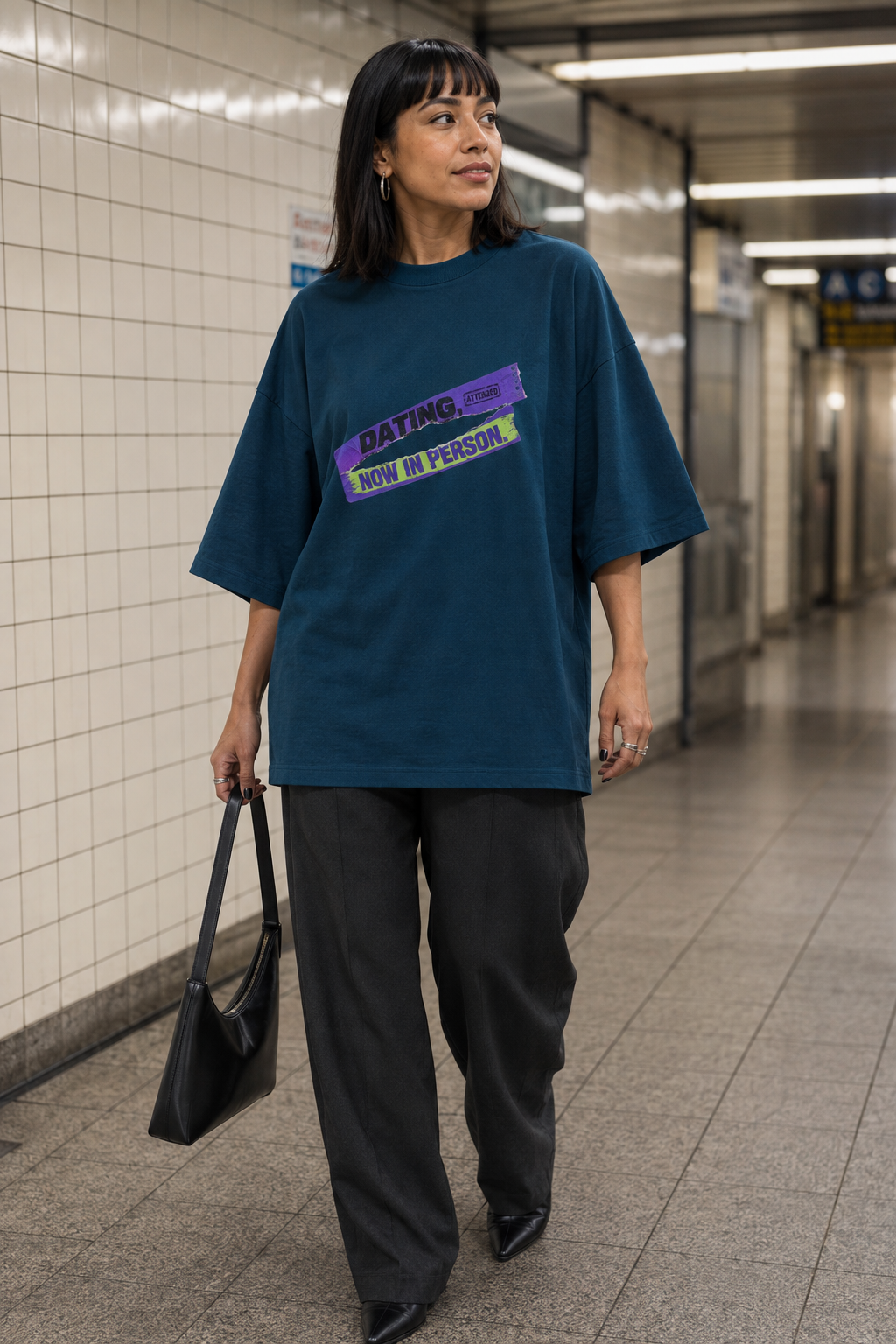 Model wearing the 3o1d DATING, NOW IN PERSON. oversized T-shirt in Deep Teal, front graphic.