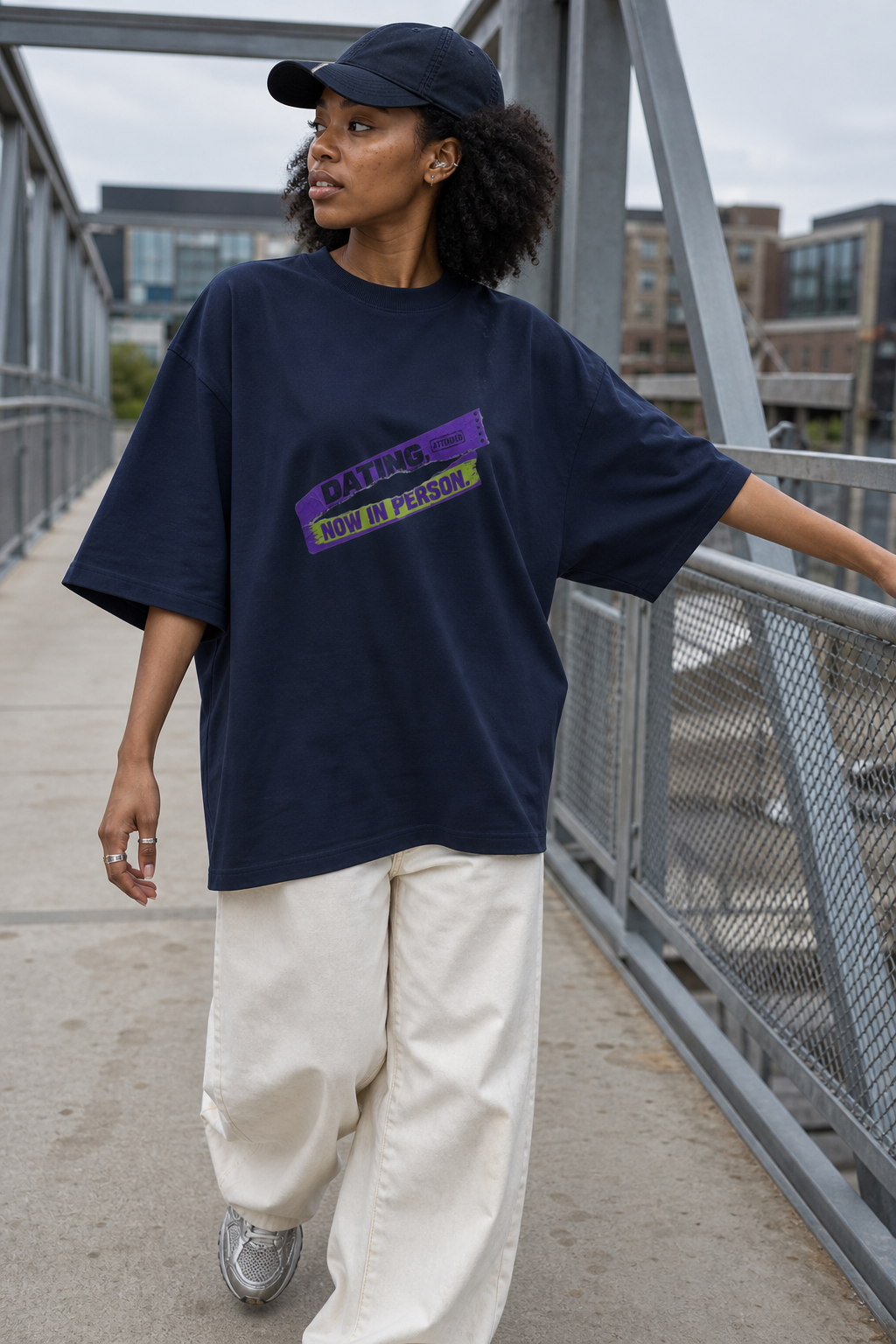 Model wearing the 3o1d DATING, NOW IN PERSON. oversized T-shirt in French Navy, front graphic.