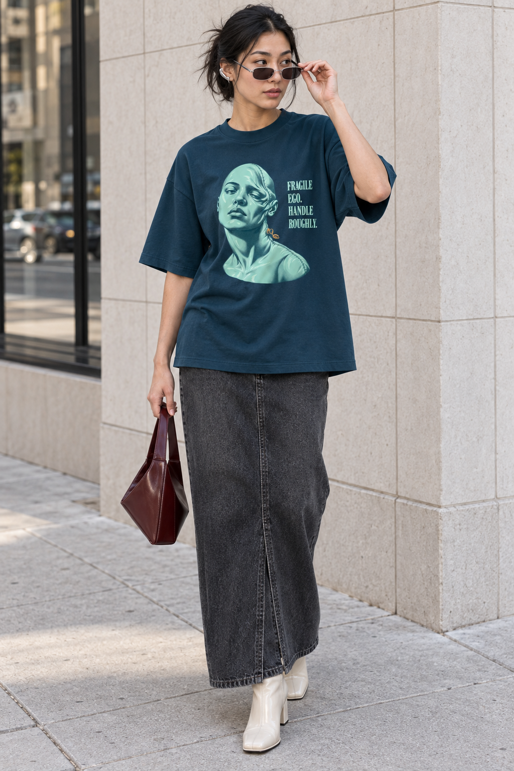 Model wearing the 3o1d FRAGILE EGO. HANDLE ROUGHLY. oversized T-shirt in Deep Teal, front graphic.