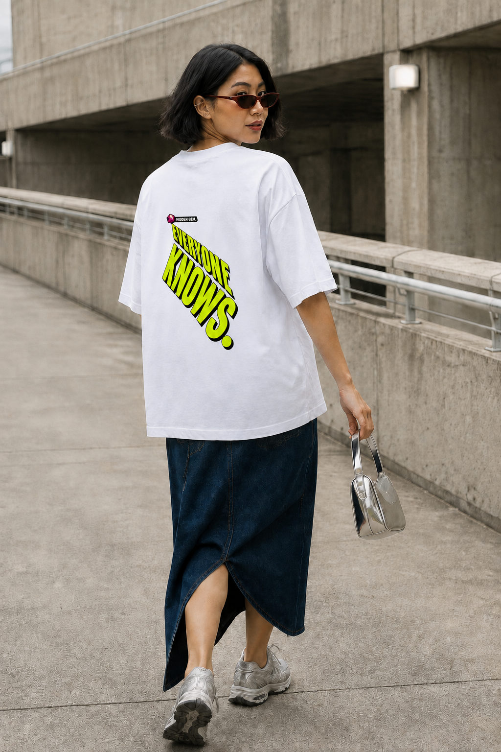 Model wearing the 3o1d HIDDEN GEM. EVERYONE KNOWS. oversized T-shirt in White, back graphic.