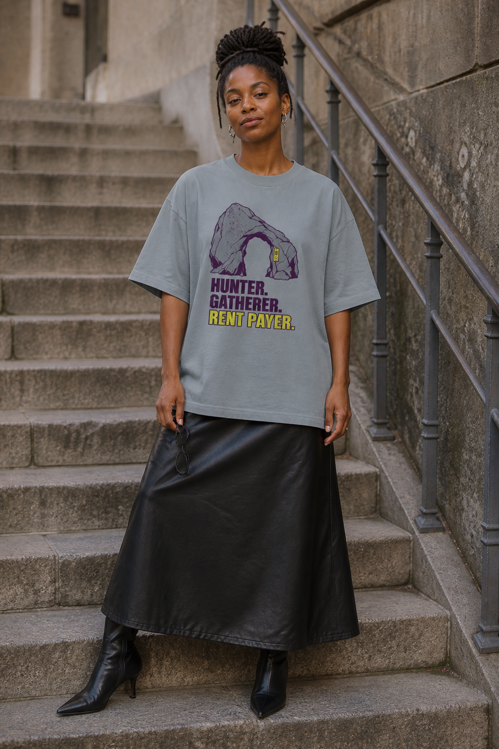 Model wearing the 3o1d HUNTER. GATHERER. RENT PAYER. oversized T-shirt in Misty Grey, front graphic.