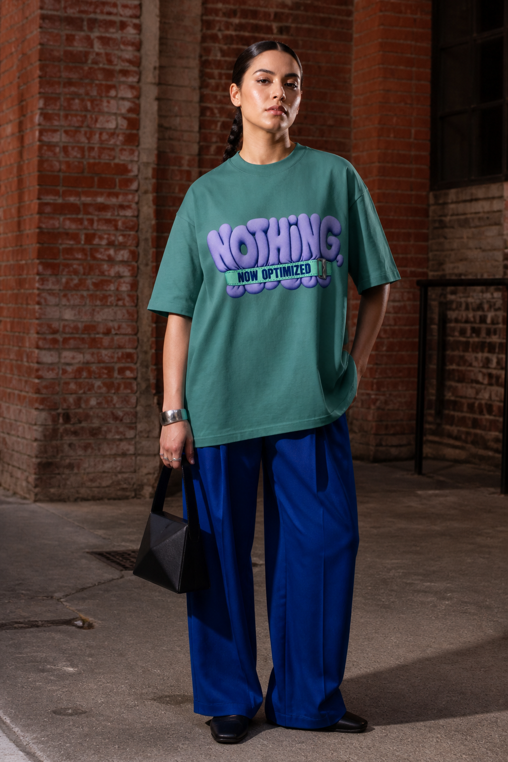 Model wearing the 3o1d NOTHING, NOW OPTIMIZED oversized T-shirt in Green Bay, front graphic.