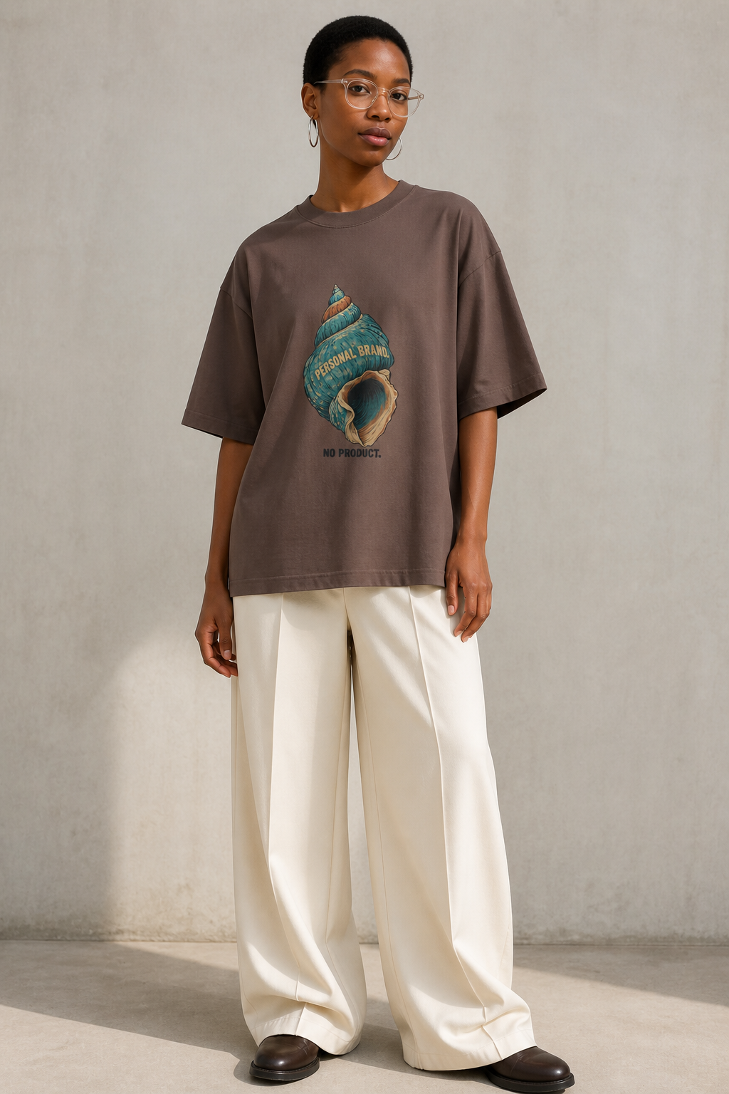 Model wearing the 3o1d PERSONAL BRAND. NO PRODUCT. oversized T-shirt in Mocha, front graphic.