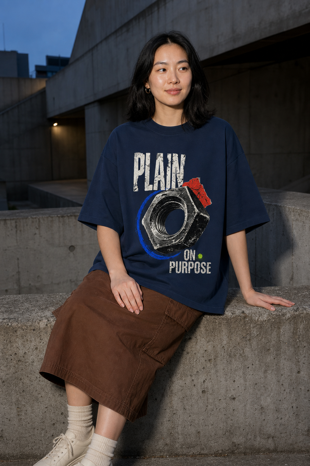 Model wearing the 3o1d PLAIN ON PURPOSE oversized T-shirt in French Navy, front graphic.