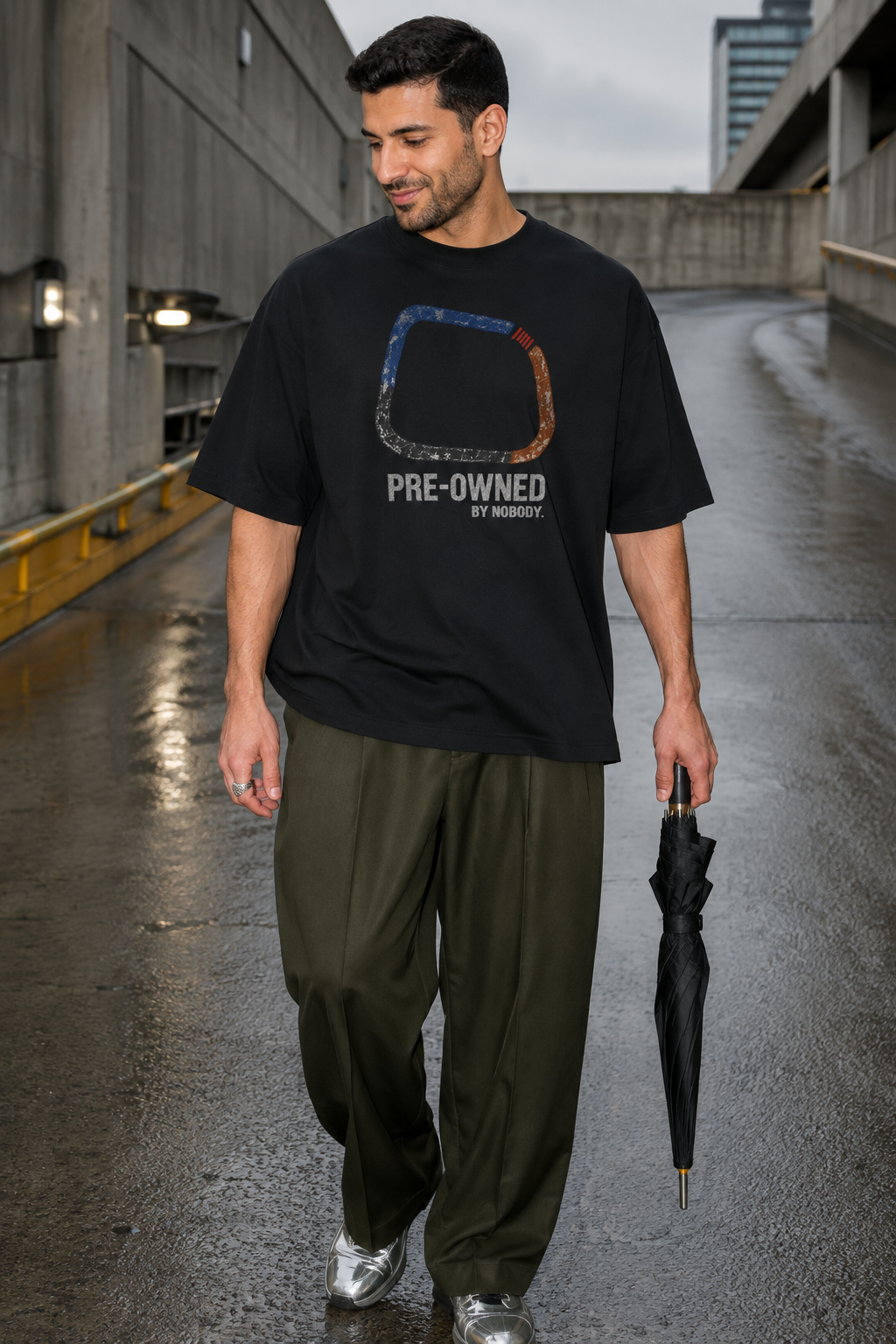 Model wearing the 3o1d PRE-OWNED BY NOBODY. oversized T-shirt in Black, front graphic.