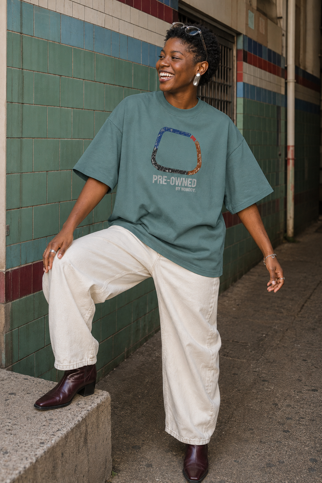 Model wearing the 3o1d PRE-OWNED BY NOBODY. oversized T-shirt in Green Bay, front graphic.