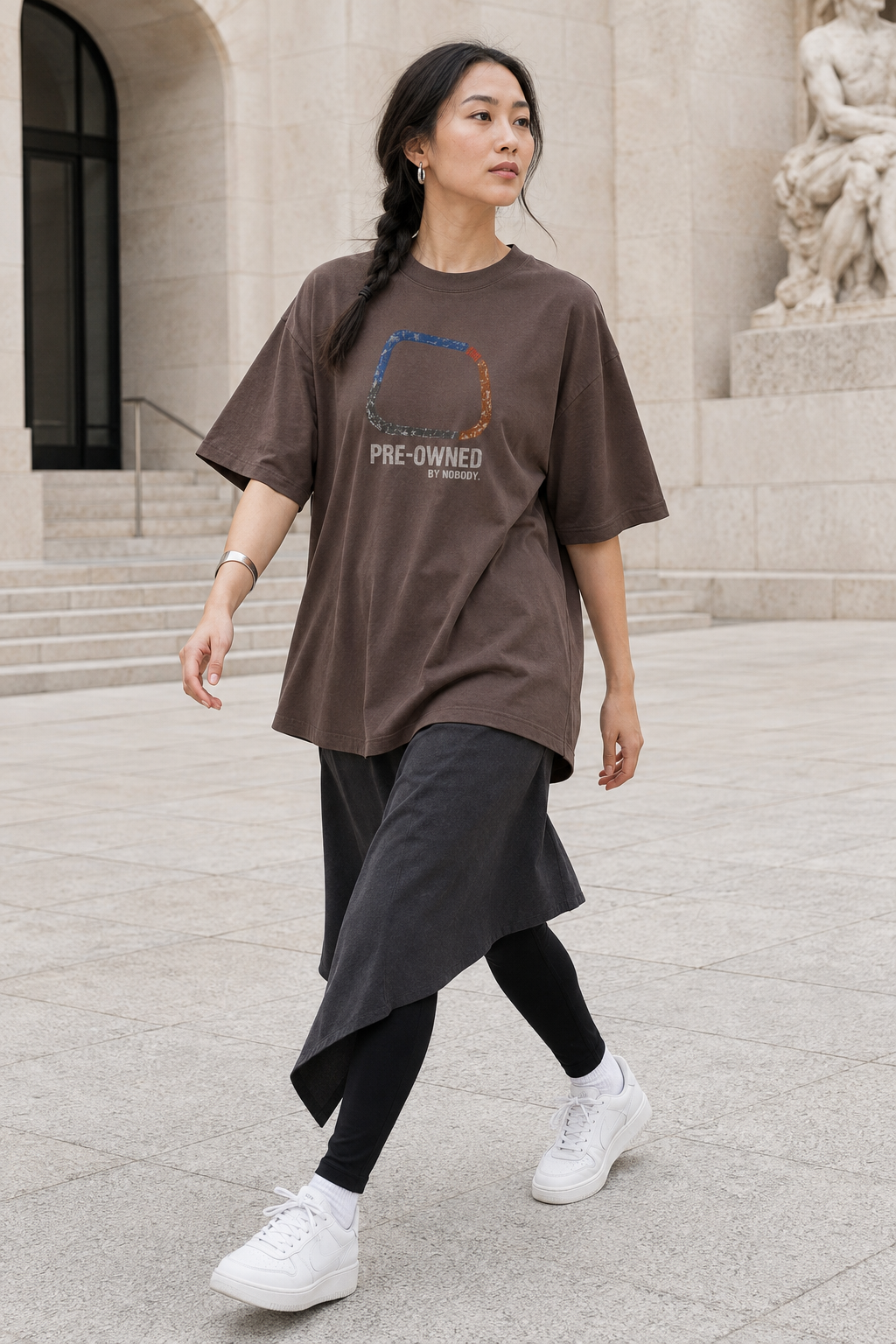 Model wearing the 3o1d PRE-OWNED BY NOBODY. oversized T-shirt in Mocha, front graphic.