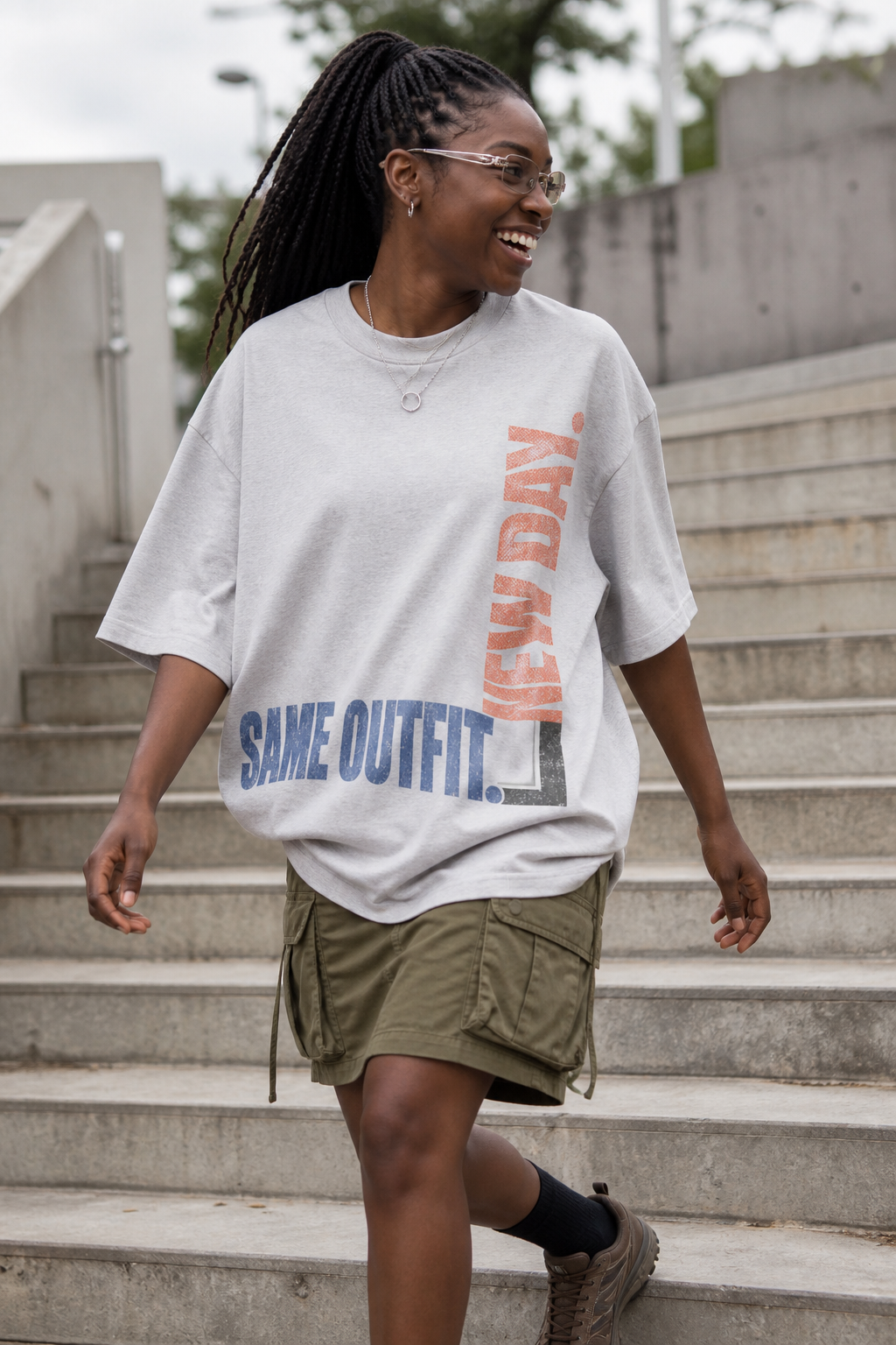 Model wearing the 3o1d SAME OUTFIT. NEW DAY. oversized T-shirt in Cool Heather Grey, front graphic.