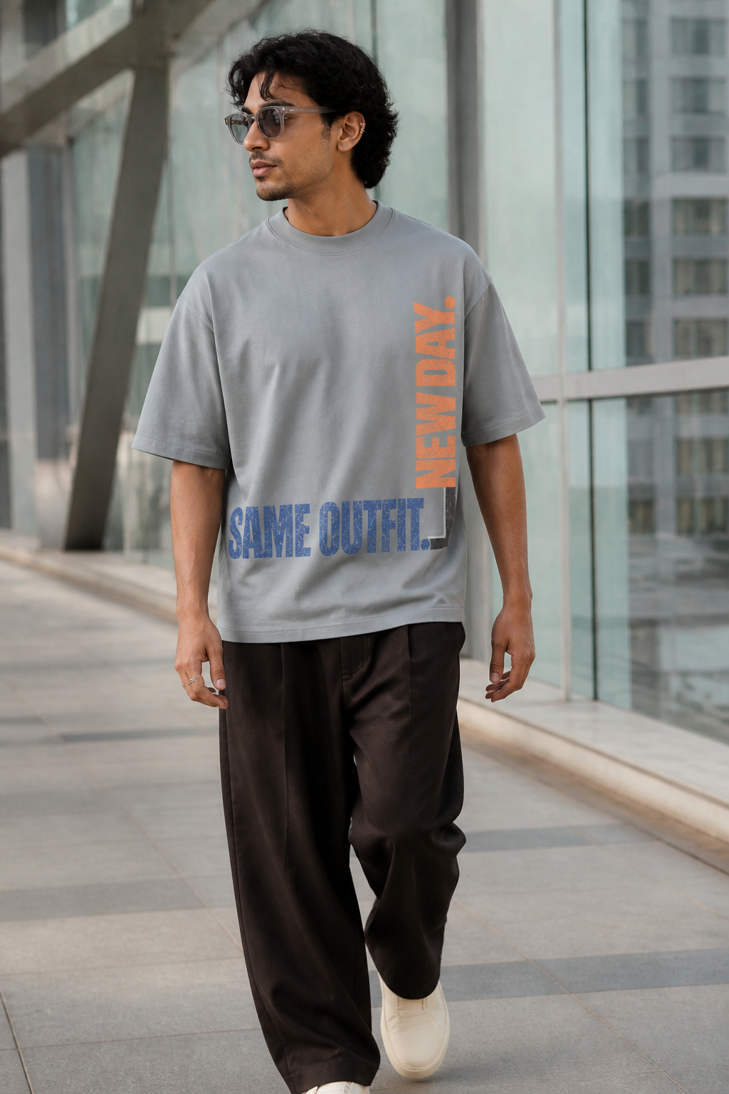 Model wearing the 3o1d SAME OUTFIT. NEW DAY. oversized T-shirt in Misty Grey, front graphic.