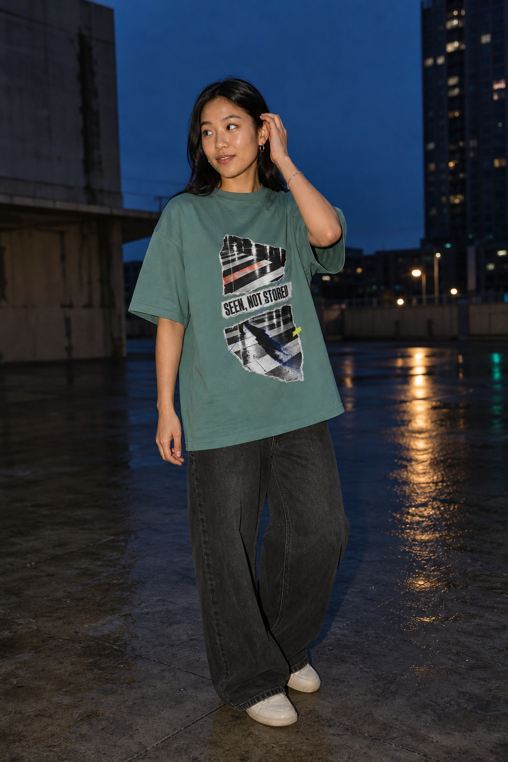 Model wearing the 3o1d SEEN, NOT STORED oversized T-shirt in Green Bay, front graphic.