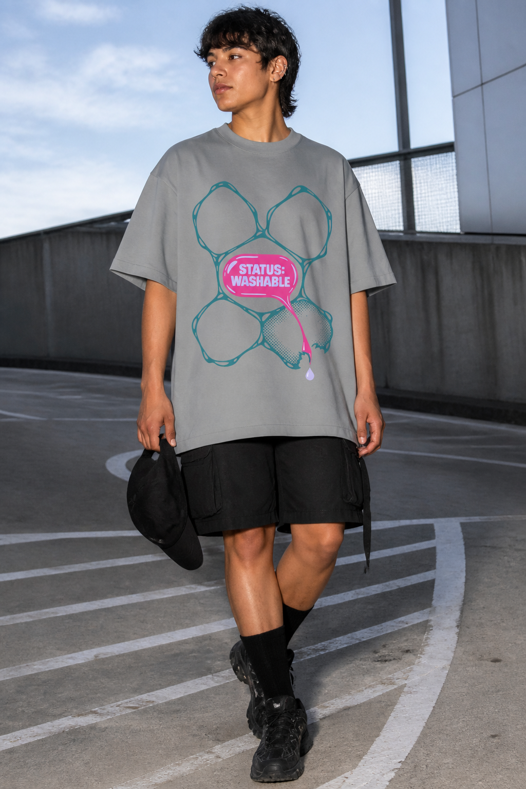Model wearing the 3o1d STATUS: WASHABLE oversized T-shirt in Misty Grey, front graphic.