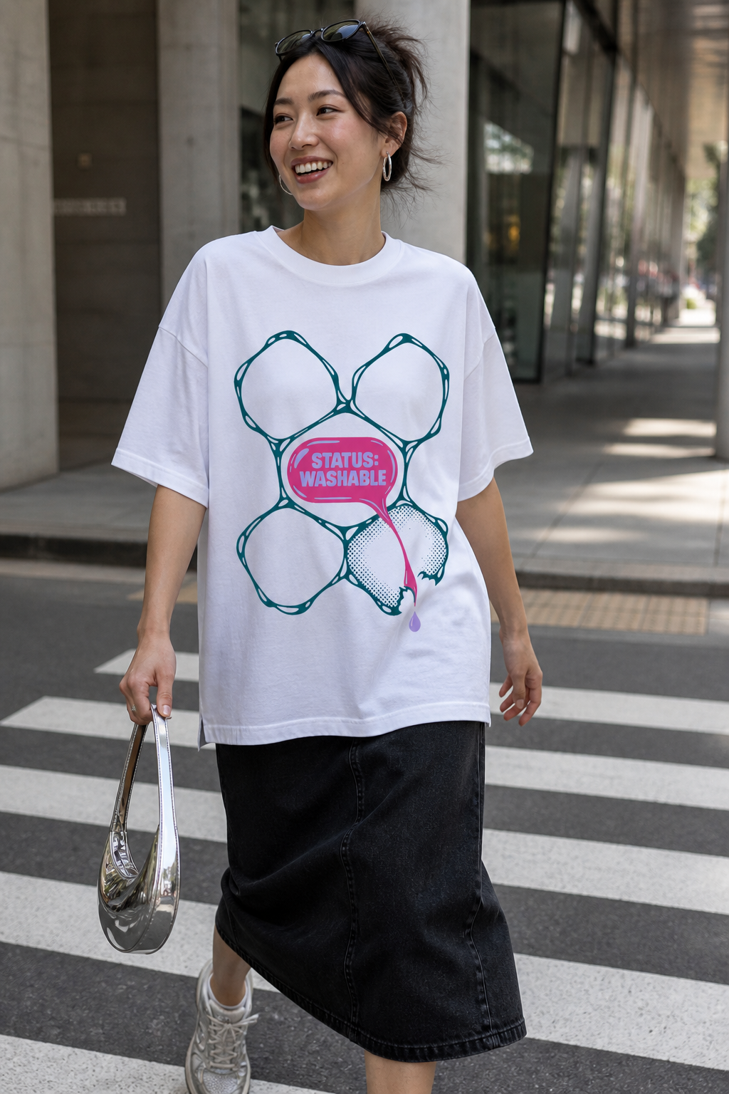 Model wearing the 3o1d STATUS: WASHABLE oversized T-shirt in White, front graphic.