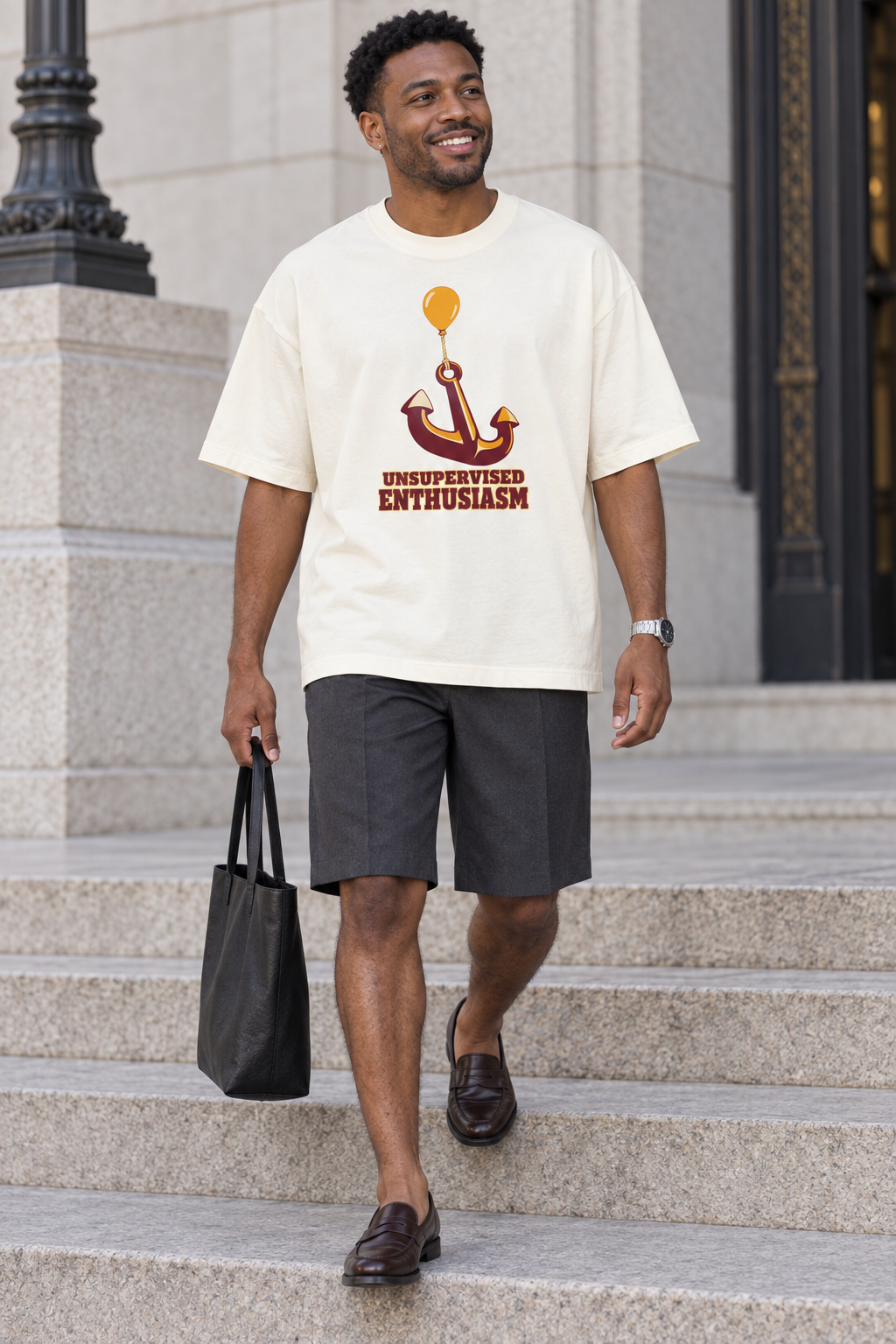 Model wearing the 3o1d UNSUPERVISED ENTHUSIASM oversized T-shirt in Cream, front graphic.
