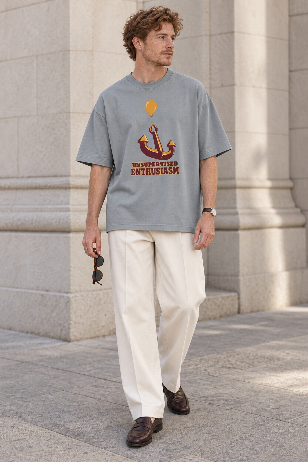 Model wearing the 3o1d UNSUPERVISED ENTHUSIASM oversized T-shirt in Misty Grey, front graphic.