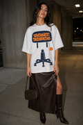 Model wearing the 3o1d VACANCY: DECORATIVE oversized T-shirt in Cool Heather Grey, front graphic.